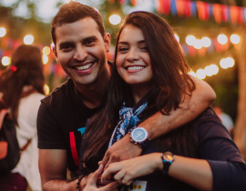 Male and female face camera, embrace smling